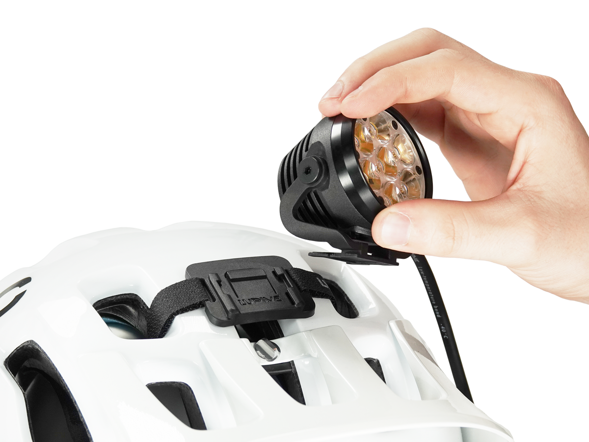 Betty BT light head being clicked into the FrontClick helmet mount