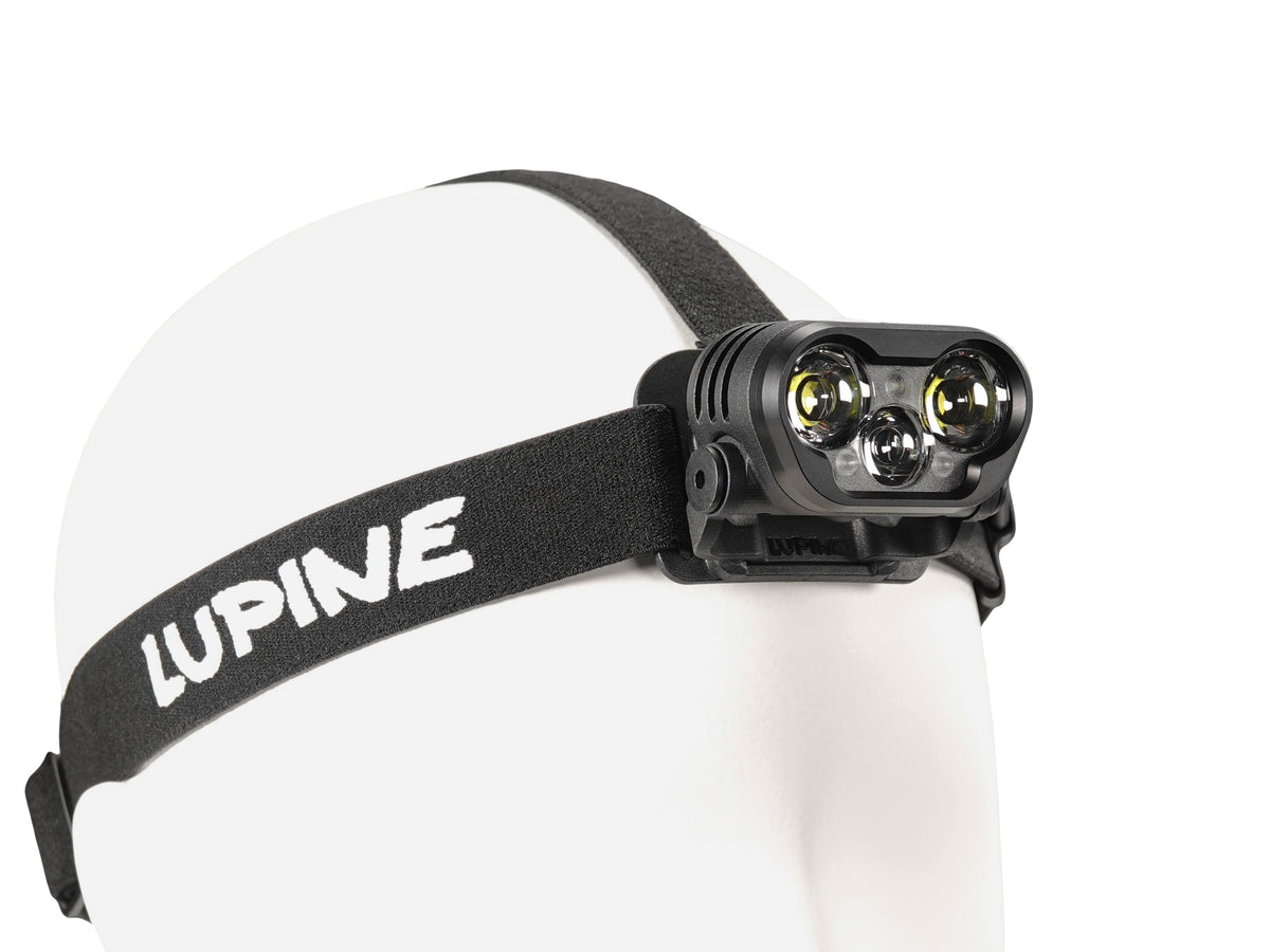 Blika headlamp on the black headband, front three-quarter view