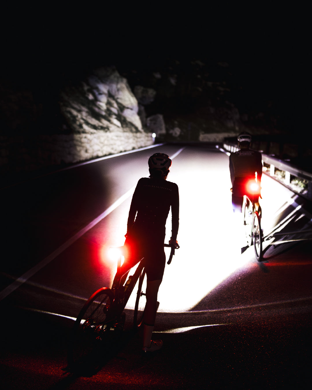 cyclists-silhouette at night with redm Lupine tail light