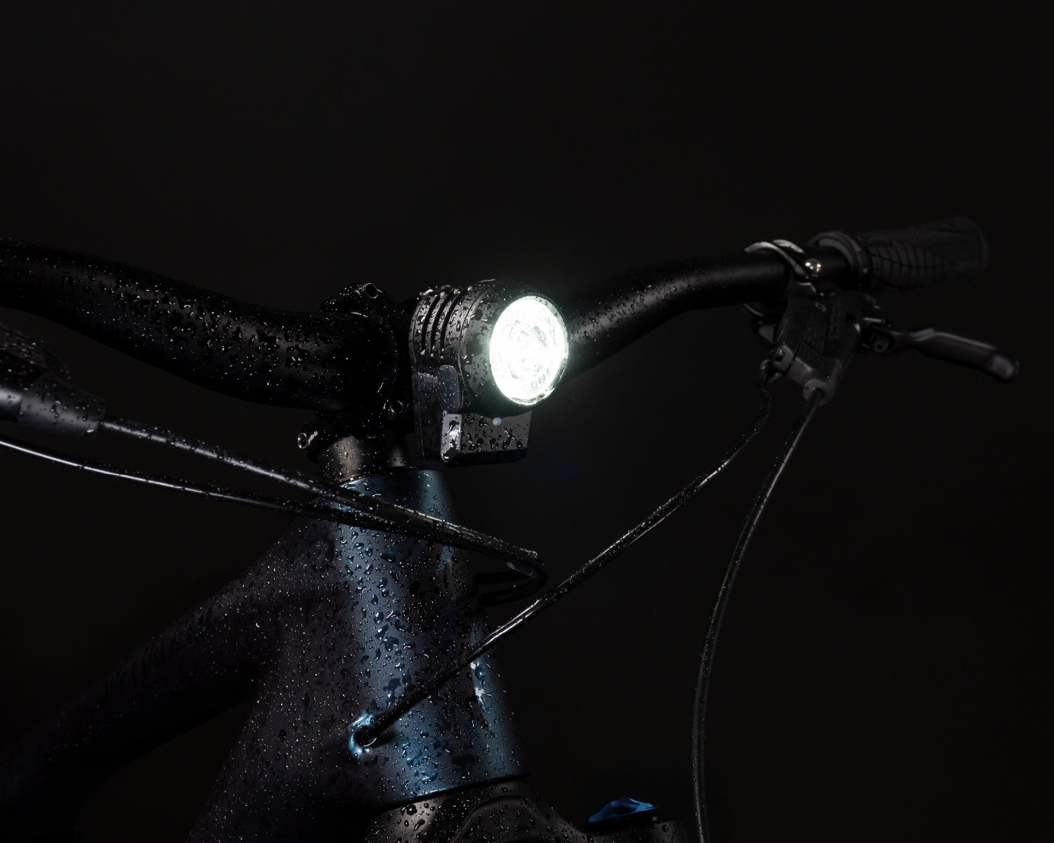 Lupine front light on the handlebar at dusk