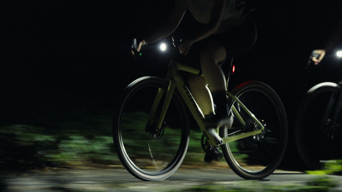 Cyclist riding at night with the Lupine SL Nano AF switched on