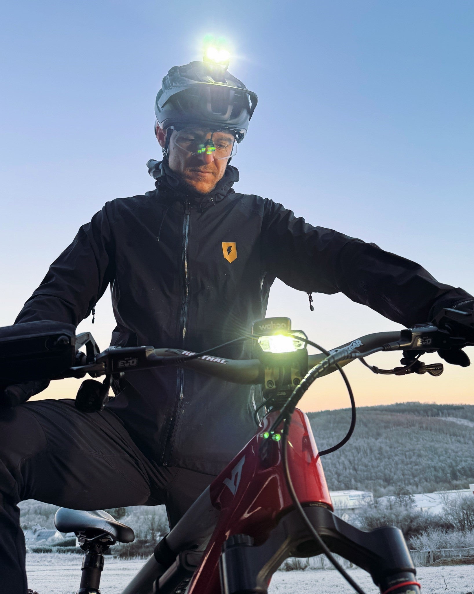 cyclists with Lupine helmet light at dusk